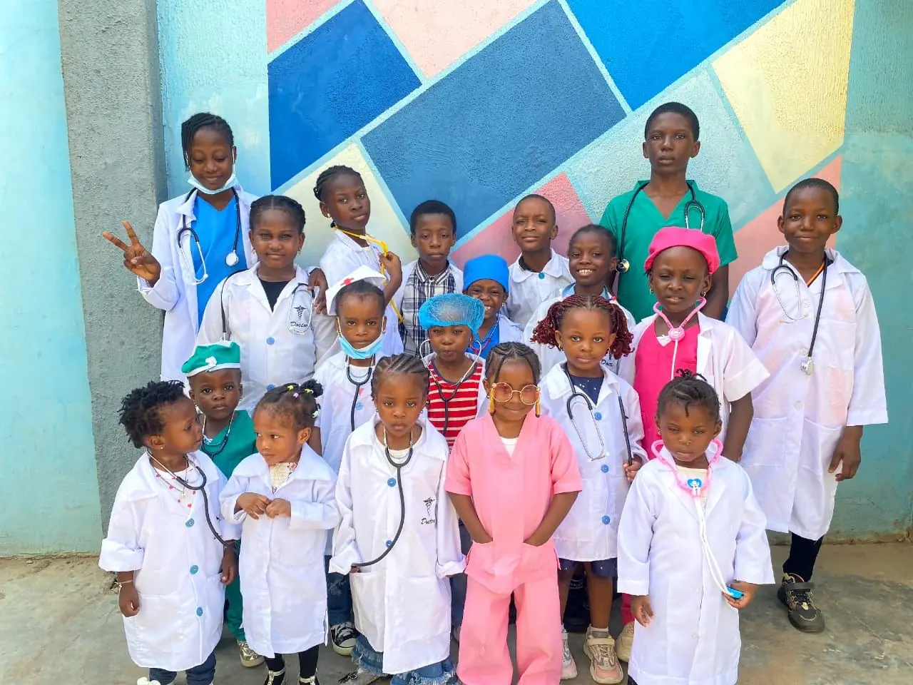 Pupils dressed as doctors and nurses in white coats with stethoscopes on Career Day